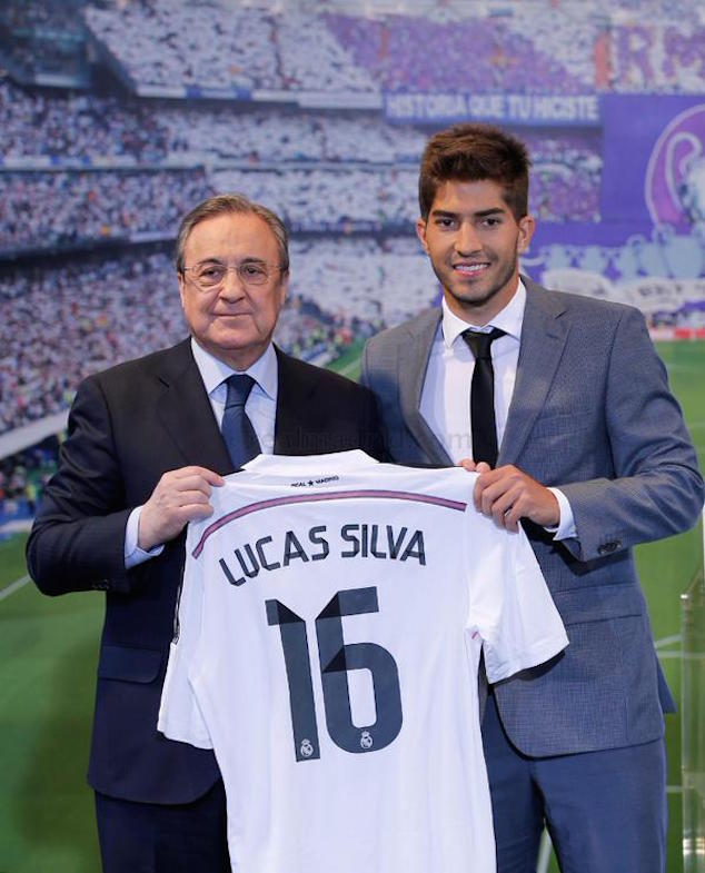 Lucas Silva and Florentino Perez show the new jersey.